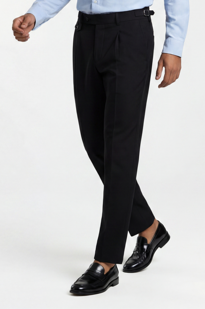 Blutailor black Gurkha trousers in premium fabric with a custom tailored fit, featuring high-waist design and adjustable side tabs for a refined, structured look.