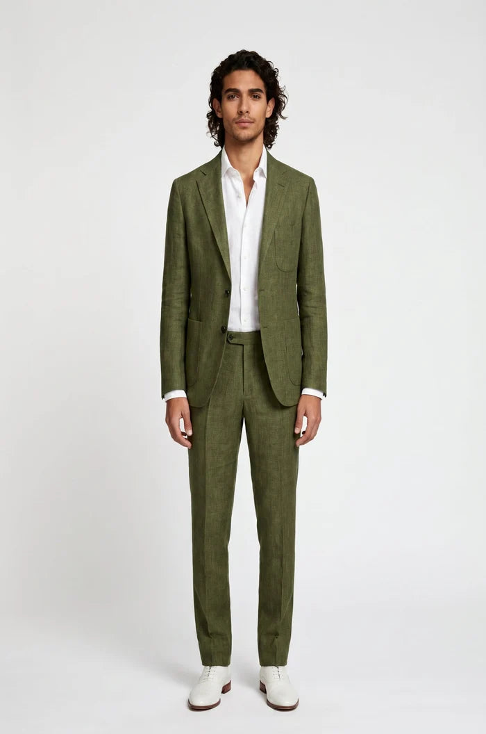 Man wearing a green suit with a white shirt on a white background