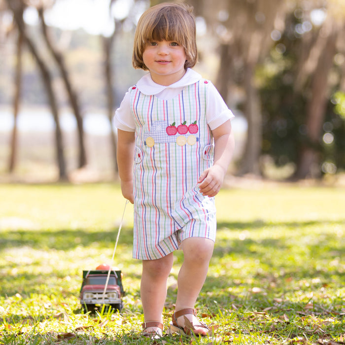 little boy pulling toy truck wearing jon jon and Boys Short Sleeve White Knit Collared Top