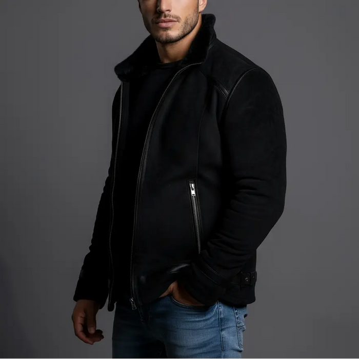 Man wearing a black leather jacket against a gray background