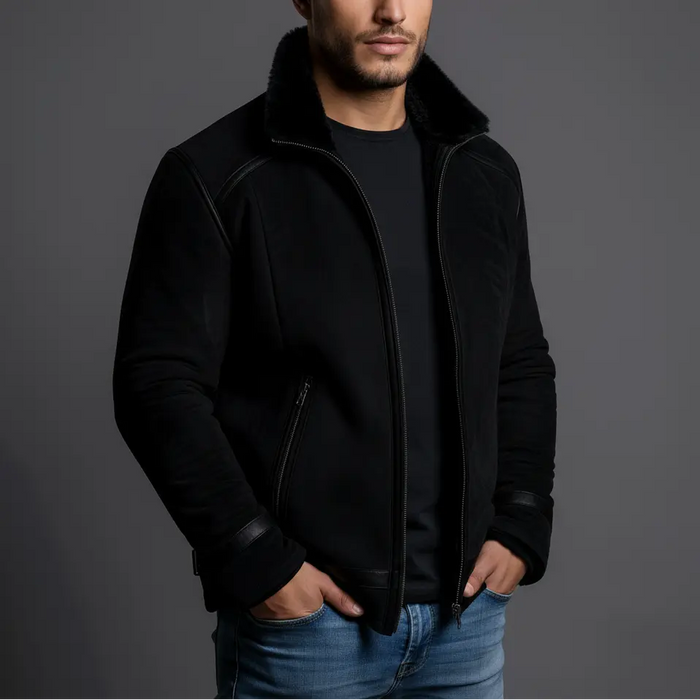 Man wearing a black jacket with a gray background