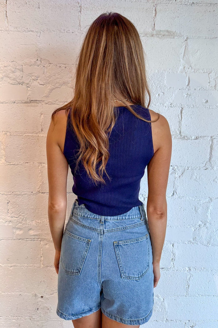 Available in red and navy
Detailed knot accents along the neckline
Soft, comfortable knit fabric
Relaxed fit for a flattering silhouette