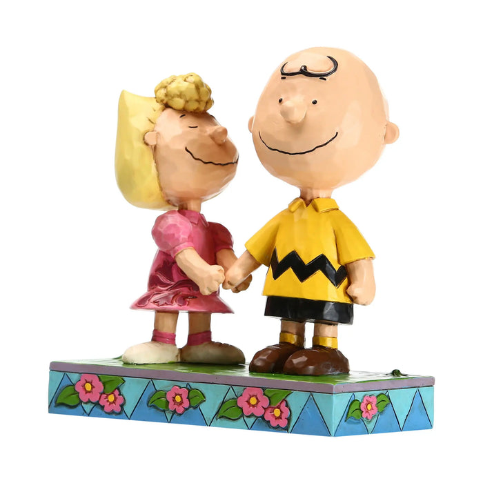 Sally holding Charlie Brown hand