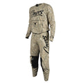 A two-piece motocross riding suit in a Realtree camouflage pattern, featuring a long-sleeve jersey and matching pants. The jersey has 'Cnvs' printed in black script across the chest, with 'REALTREE CAMO' and a bull skull logo underneath.